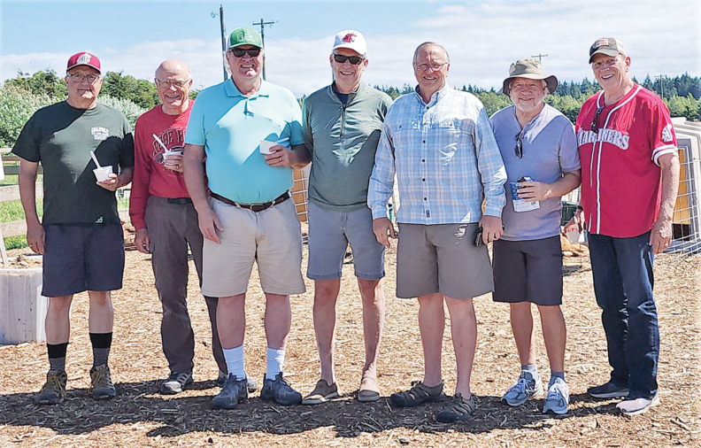 a group of Washington State University alums in a row