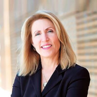 Profile head shot of Tricia Raikes