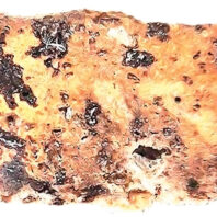 Close up of an ancient yellow piece of glass