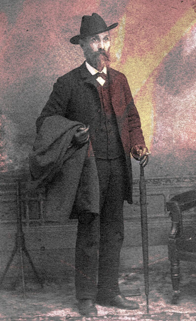 Old photo of Washington state Black pioneer and legislator William Owen Bush in a suit with a hat and cane