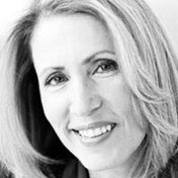 Black and white headshot of Tricia Raikes