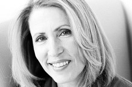 Black and white headshot of Tricia Raikes