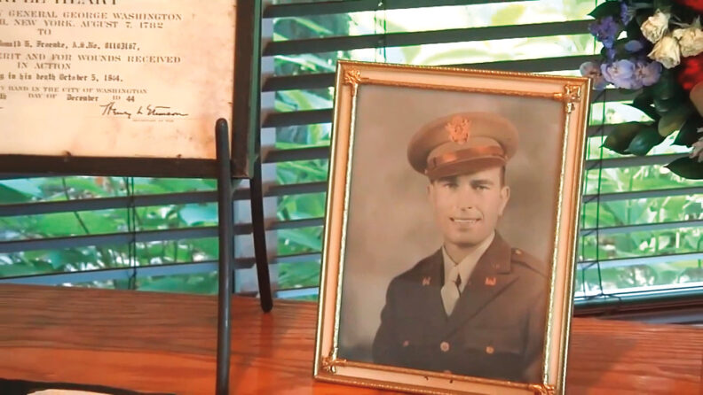 Framed sepia photo of US soldier in World War II uniform