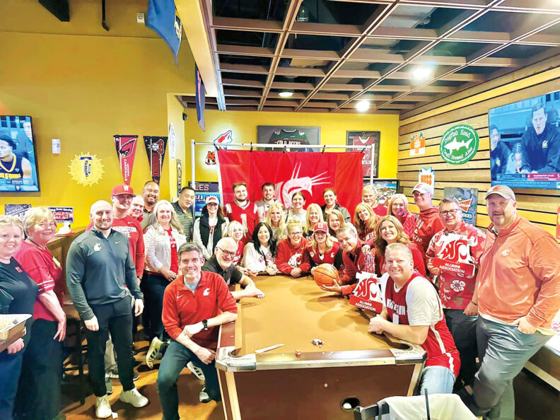 Large group of people wearing Washington State University gear