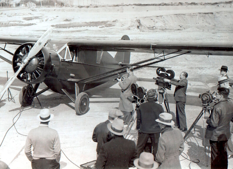 camera crews with Miss Veedol airplane