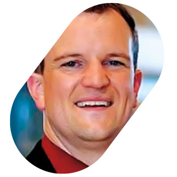 Closeup of Brian Gates framed like an oval pill