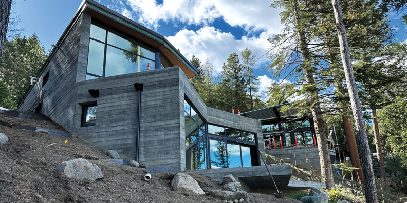 large home under construction in the woods