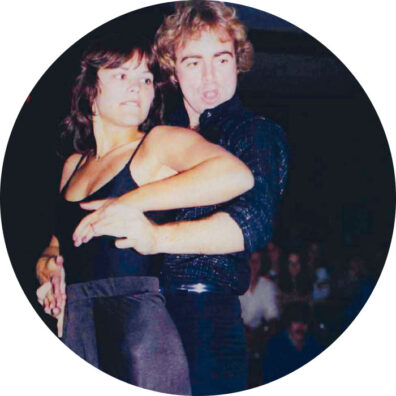 WSU woman and man embrace at a disco dance in 1970s