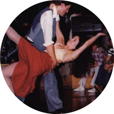 A WSU male student dips his female partner at a disco in 1979