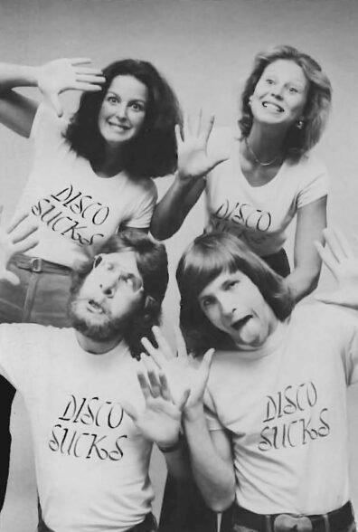 Four young people wearing Disco sucks t-shirts
