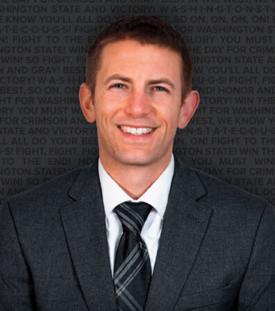 Closeup of Chris King in a gray suit with dark gray tie