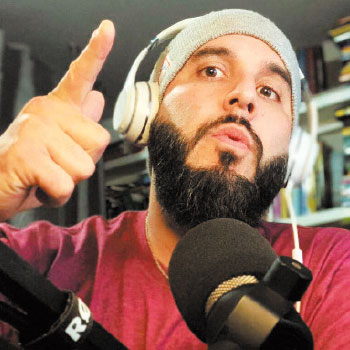 Johnny Lupinacci talks into a mic