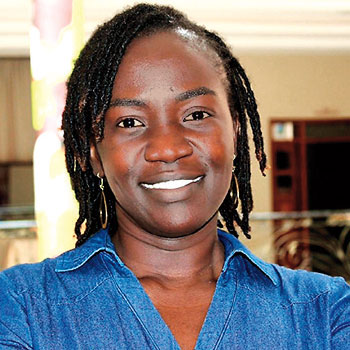 Profile of Carolyne Nasimiyu in blue shirt