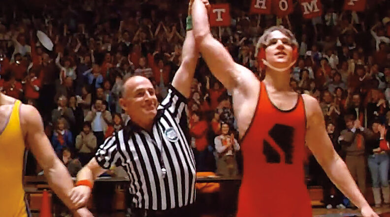 Frame from Vision Quest of the end of a wrestling match