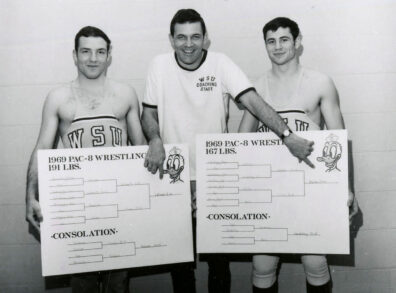 Wrestling coach Roger James with Mike Latimer and Rick Sicilia, Pac-8 champions in 1969