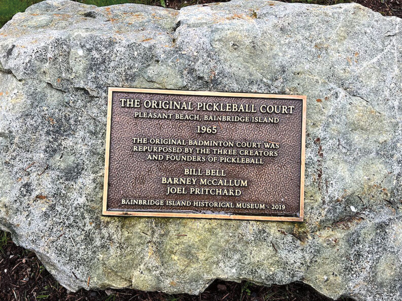 Bronze plaque on a rock with text The Original Pickleball Court, Pleasant Beach, Bainbridge Island, 1965