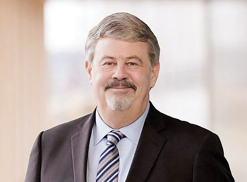 Headshot of Dennis Vermillion in a suit