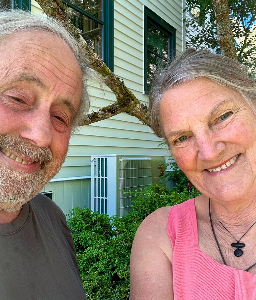 Tom and Mary Fisher with heat pump