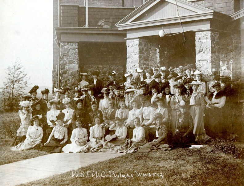 Group portrait of members of Washington State Federated Women's Club including Mrs. E. A. Bryan in front of Stevens Hall on the WSC campus in 1902