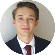 Headshot of John Williams in suit and tie