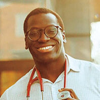 Joel Bervell smiling with stethoscope