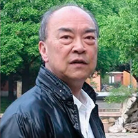 Alex Kuo wearing dark jacket outside