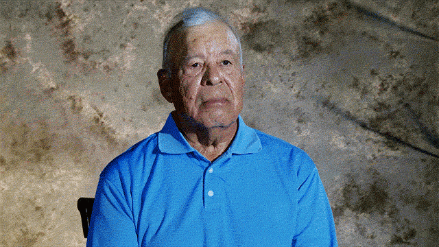 Ruben Lemos in a blue shirt talking