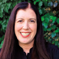 Head shot of Kate Watts smiling outside
