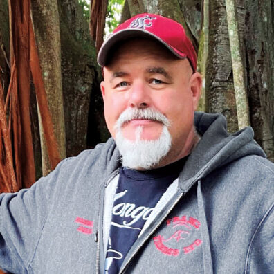 Dennis Swinger in WSU logo baseball cap and coat