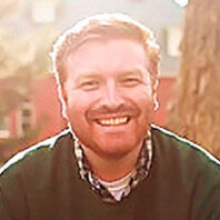 Kevin Schilling smiling head shot outside on WSU Pullman campus