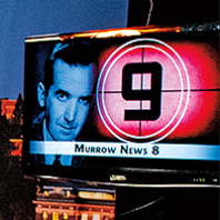 Television monitor displaying the number nine and the text ‘Murrow News 8,’ with a grayscale portrait on the screen
