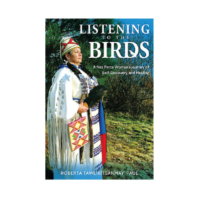 Book cover showing a woman wearing Native regalia and holding a fan outdoors, with the title ‘Listening to the Birds: A Nez Perce Woman’s Journey of Self-Discovery and Healing.’