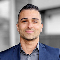 Headshot of Imran Haider in blazer and dress shirt