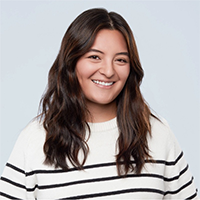 Headshot of Kendall Hoy smiling in sweater