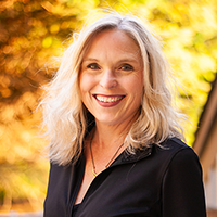 Headshot of smiling Rebecca Cooney