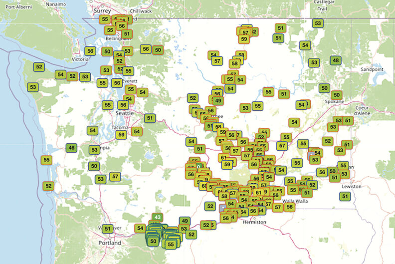 Map of Washington state and surrounding areas displaying dozens of weather monitoring locations, with colored numbered markers indicating temperature or environmental readings across the region.
