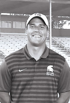 Peyton Pelluer coaches at his high school alma mater