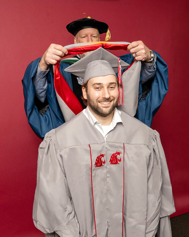 Student getting hooded.