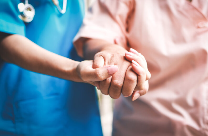 Doctor assisting patient walking