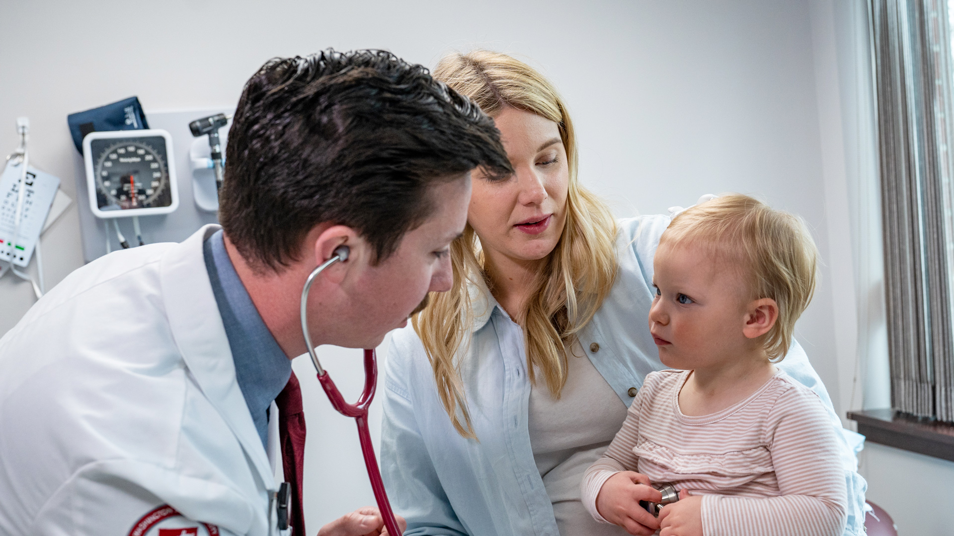 MD Student checking toddlers heart beat