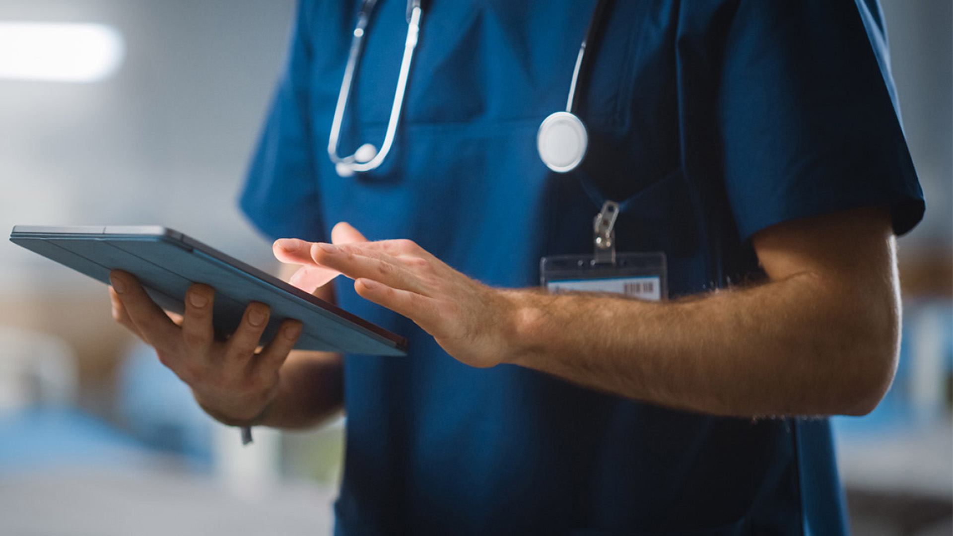 Doctor holding a tablet.