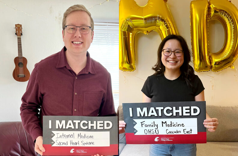 MD Students Nathan Brown and Liana Bloom holding matched day signs.