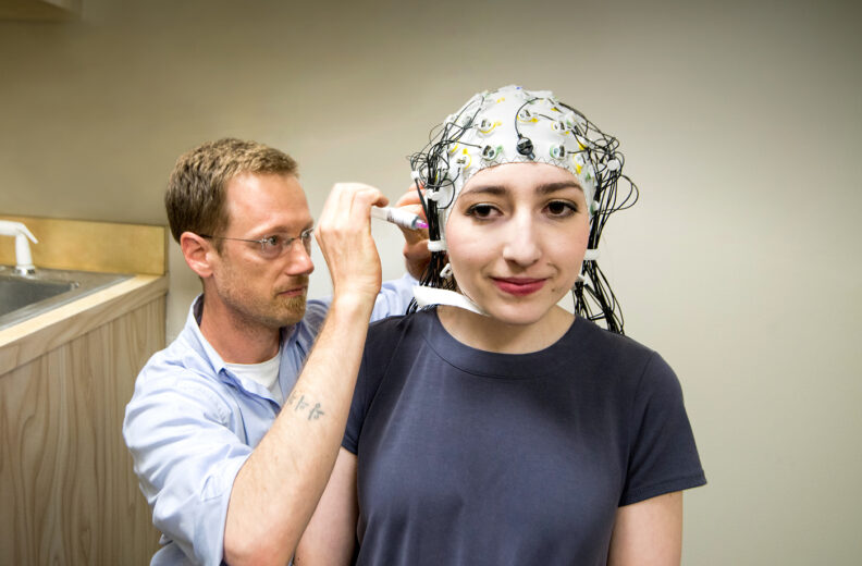 WSU Speech and Hearing Sciences Associate Professor David Jenson, PhD, uses electroencephalography to record electrical activity in the brain.
