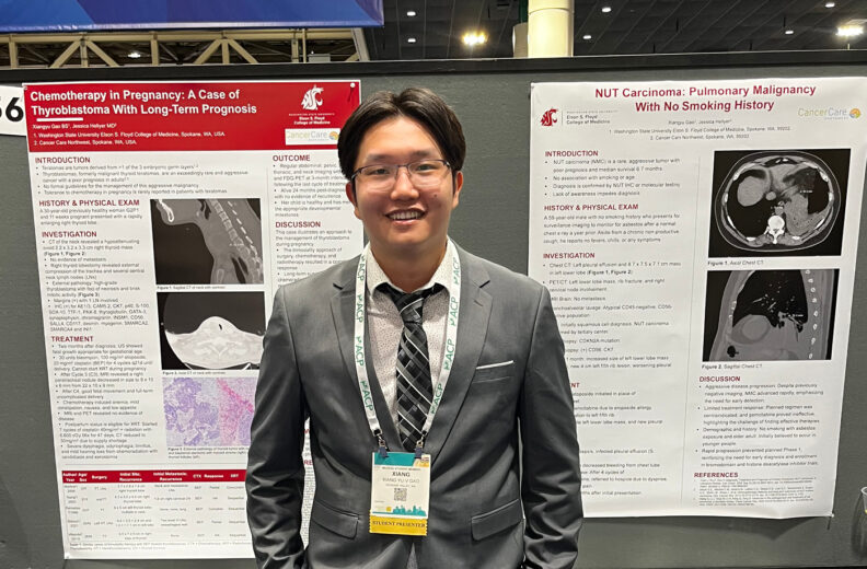 MD Student Xiang Yu "Vincent" Gao standing in front of his poster presentation.