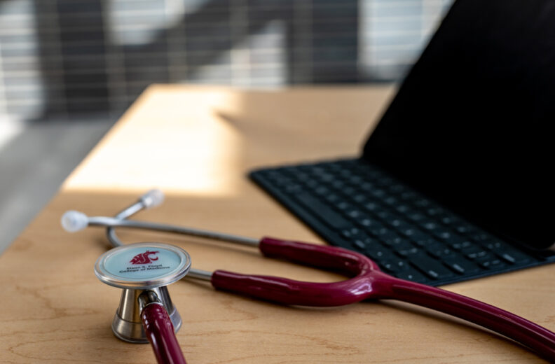 WSU Stethoscope with a laptop behind it.