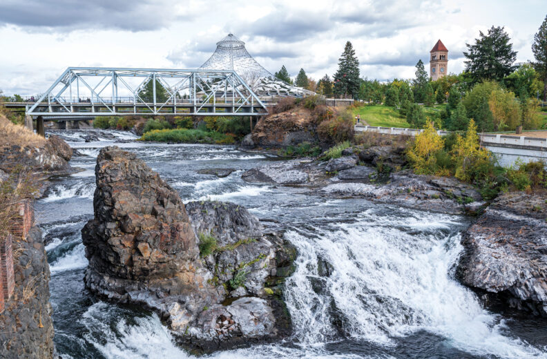 Downtown Spokanes riverfront with the river, bridge and pavilion in view.