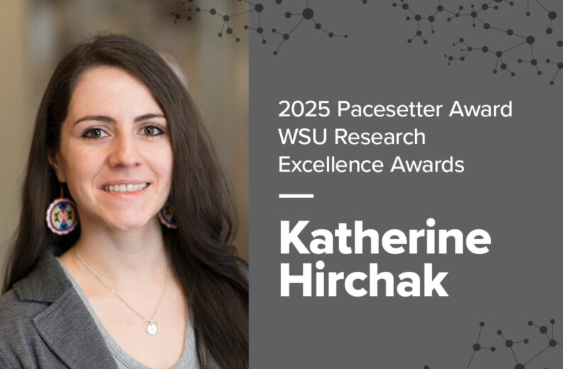 A graphic featuring a person wearing a gray blazer and light-colored top with a necklace and round earrings. On the right side, text reads: “2025 Pacesetter Award WSU Research Excellence Awards — Katherine Hirchak.” The background is gray with a pattern of connected dots resembling a molecular or network design.