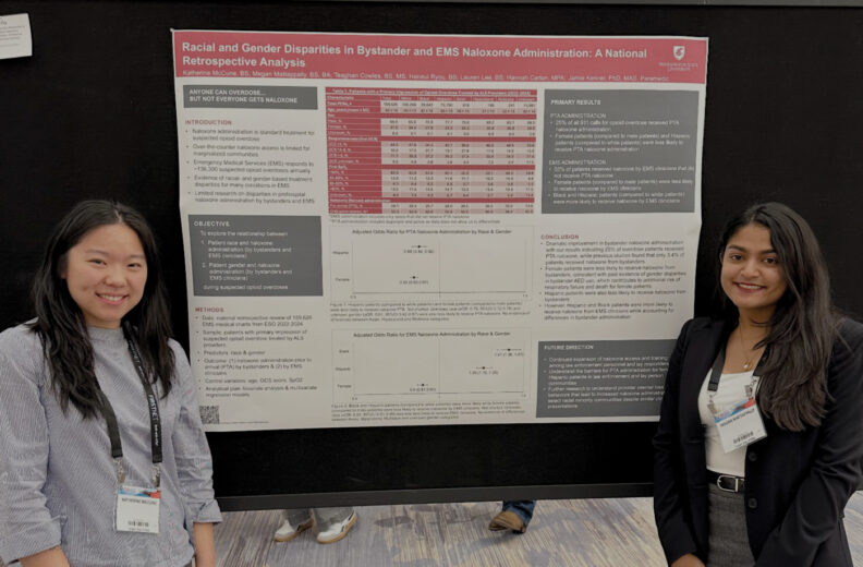 Two people stand on either side of a large academic poster displayed on a black presentation board at a conference. The poster includes charts, tables, and text with a red-and-white heading about disparities in bystander and EMS naloxone administration.