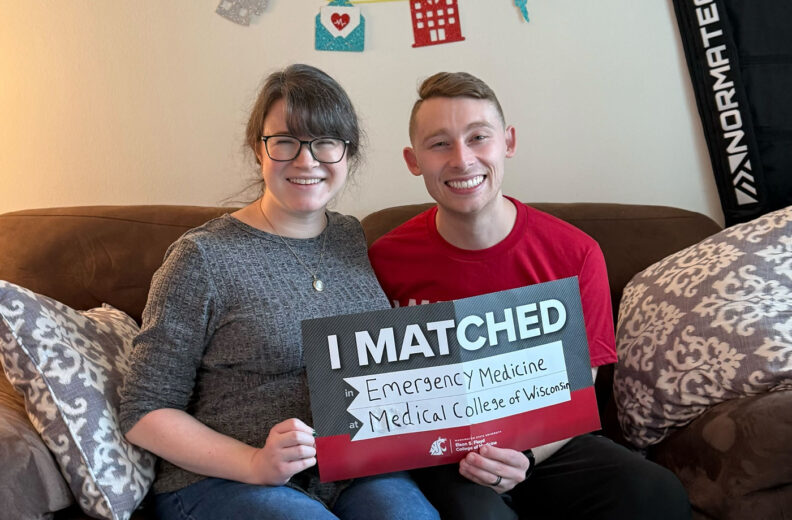 Tyler Flannery holding I matched sign.