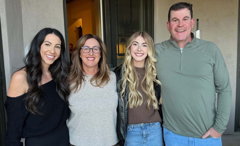 Four people smiling for a photo.